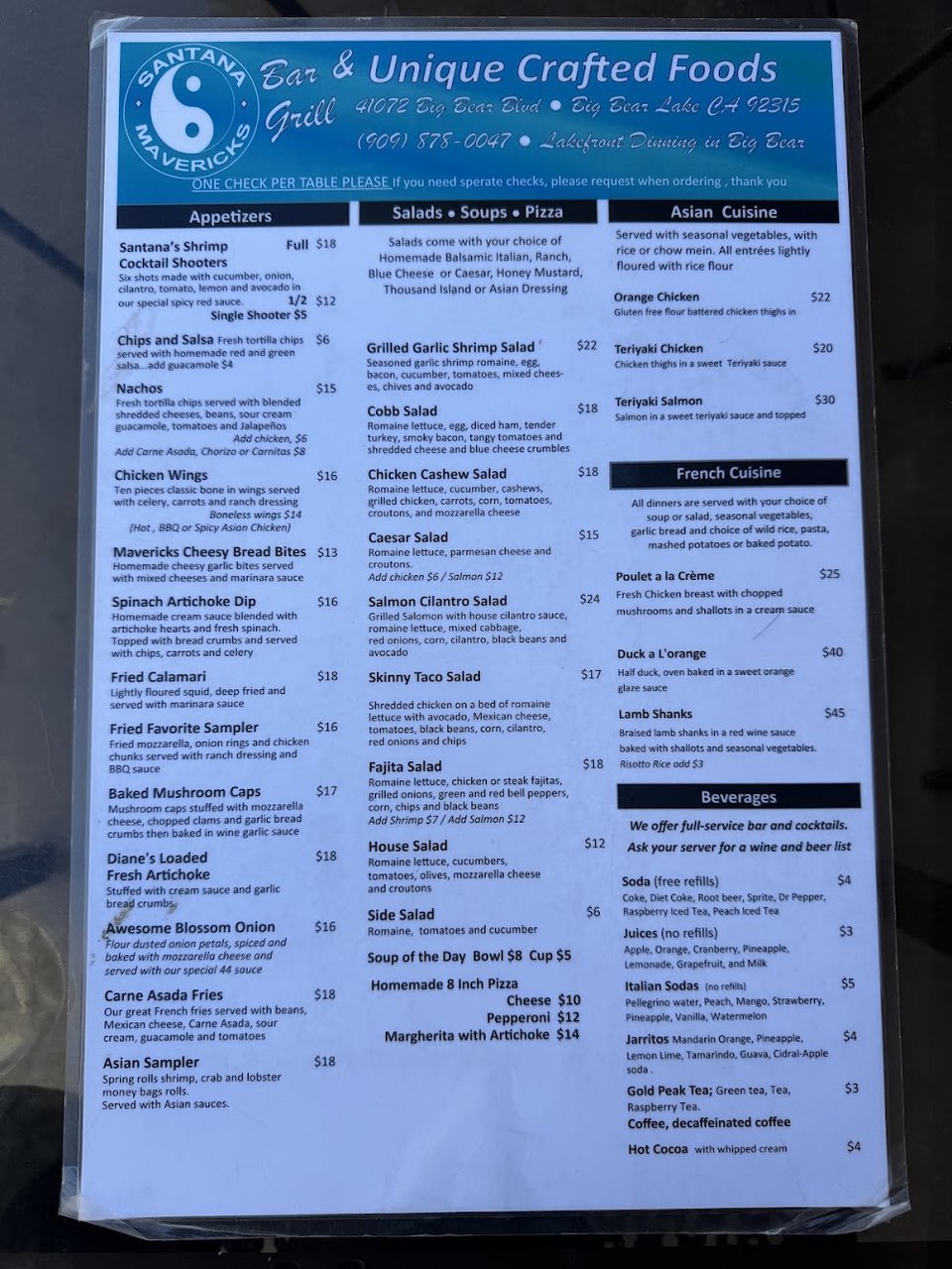 Printed menu laid out on a table.